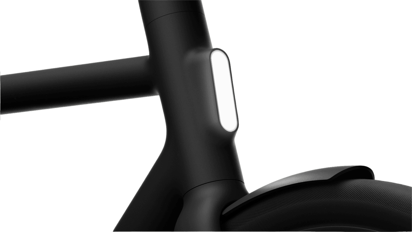 The frame of a black e-bike with a light on the seat tube.